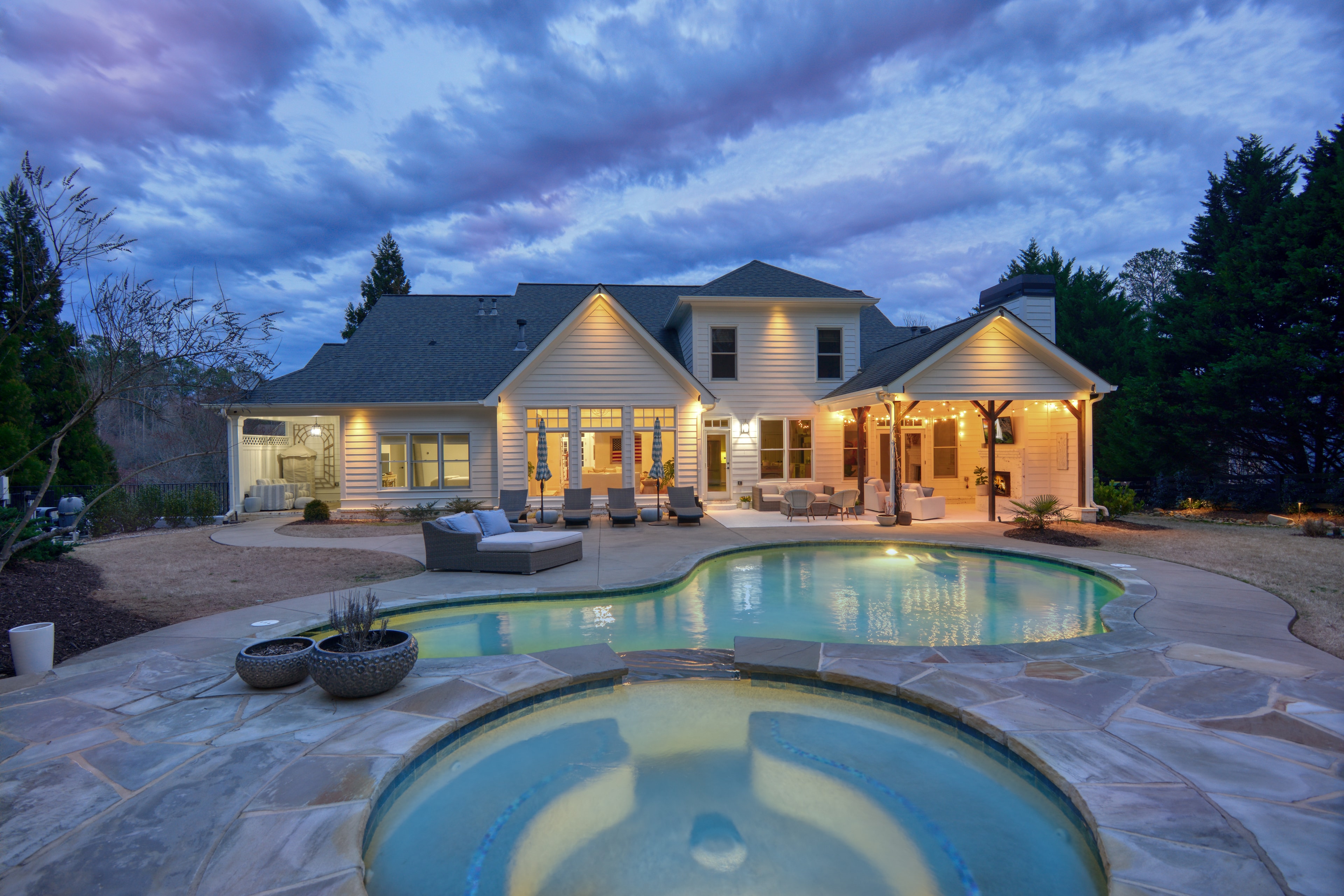Twilight dusk luxury home pool exterior